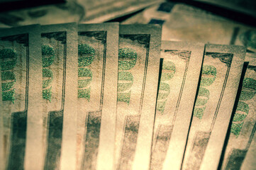 Top view of one hundred dollar banknotes made as a background. USD currency concept. Texture of American dollars