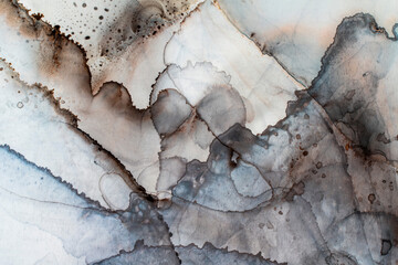 Abstract art; A detail from an alcohol ink painting. A subtly colorful abstract painted background, with strong texture.