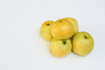 ripe yellow apples on a white background
