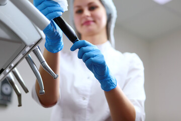 A dental assistant disinfects instruments before receiving patients.Disinfection of dental equipment. The concept of sanitation and hygiene in the clinic.Bottom view