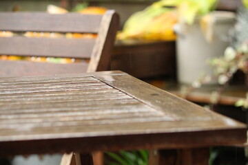 in the rain: wooden garden furniture