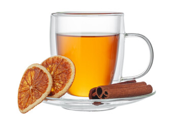 Glass cup of tea and cinnamon sticks isolated on white