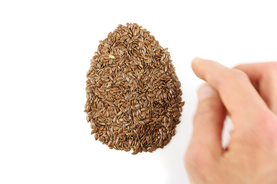 Flax Seeds Arranged In Egg Shape, Replacing Eggs In Vegan Or Vegetarian Recipe, Close Up Top View, Veganism Cooking