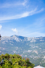 Mountain landscape. High mountains of Montenegro, blue sky, hedge of green plants
