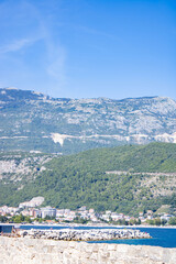 Mountain landscape. High mountains of Montenegro, blue sky, city at the foot of the mountain.