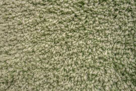 abstract background of green carpet texture close up