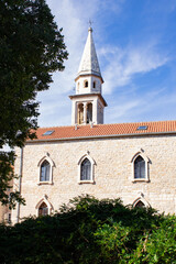 Fototapeta premium Church on a sunny day. The ancient building of the church against the blue sky
