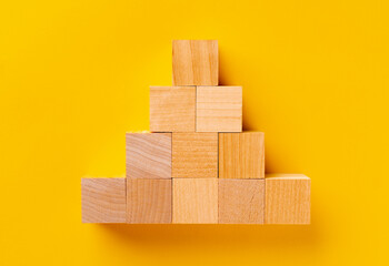 Top view of wooden cubes on yellow