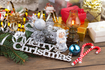 Merry Christmas, postcard with gifts and Christmas decorations.