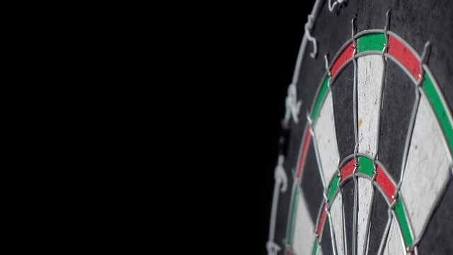 Three darts in the bull's eye on the Dartboard.