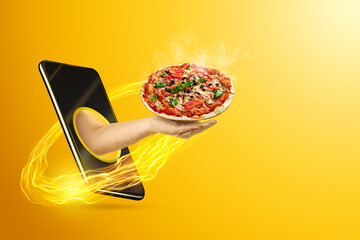 Hand serves pizza via smartphone on yellow background. The concept of food delivery, online ordering, restaurant services at home.