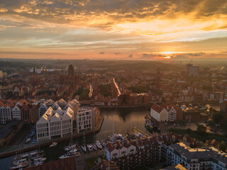 Fototapeta na wymiar Aerial sunset view of the amazing old town and rivers of Gdansk with ships