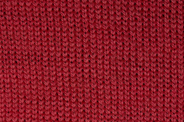 Red woolen background. Warm clothes.