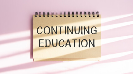 continuing education text write on paper, business concept