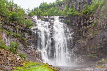 Skjervefoss waterfall in the forest, Norway, hidden secret waterfall