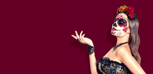 Sugar skull makeup. Halloween party, traditional Mexican carnival, Santa Muerte. Beautiful young...