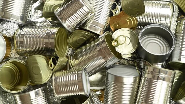 Metal tins and cans ready for recycling. top view, rotating