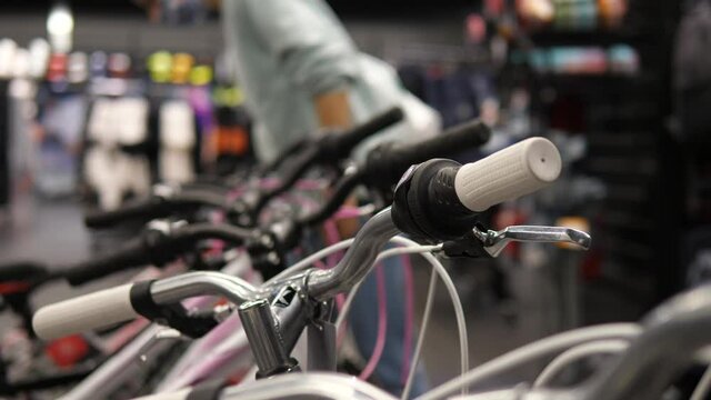 Close up of handlebars of a bicycle displayed in sport store 