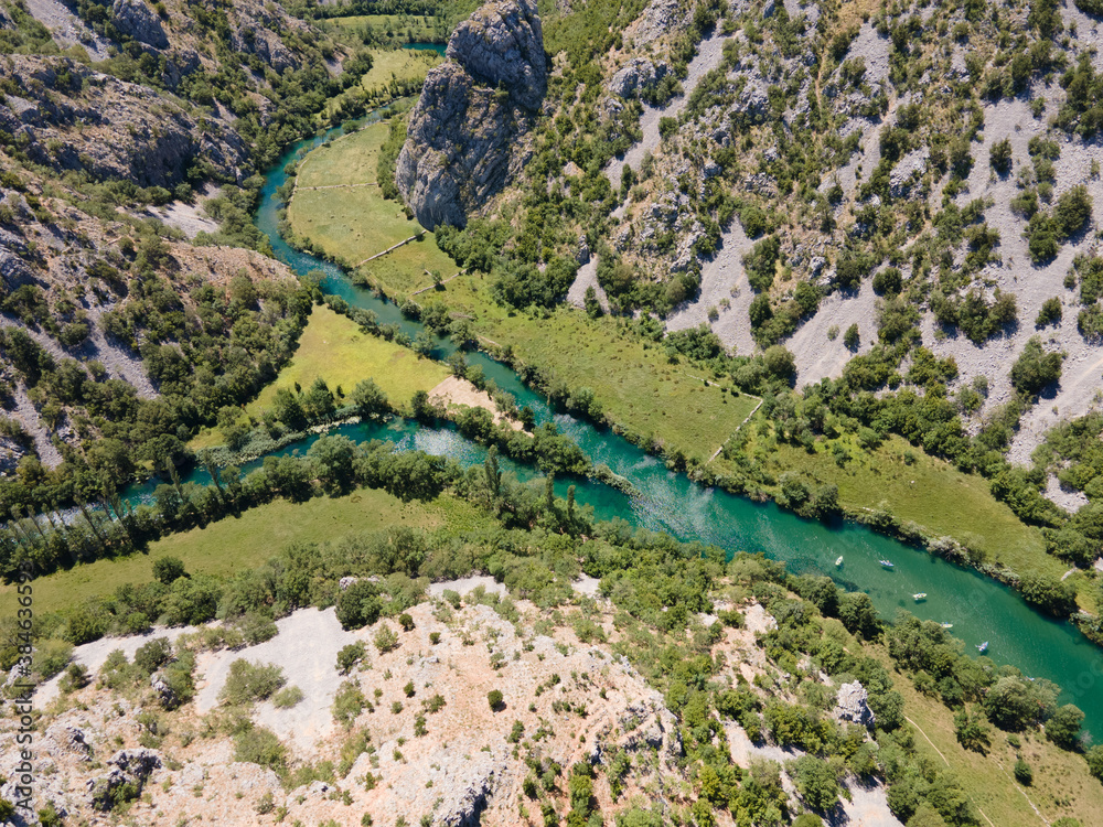 Sticker Zrmanja River in northern Dalmatia, Croatia is famous for its crystal clear waters and countless waterfalls surrounded by a deep canyon.