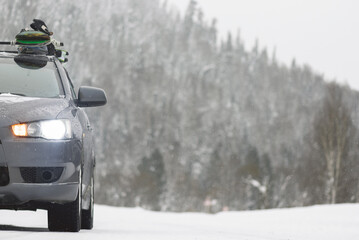 A snowboards on car roof background.