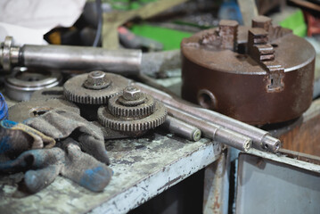 A turner workbench with a various details above background.