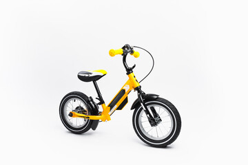 Fototapeta na wymiar yellow balance bike on white background