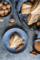 Rolled triangle pies with walnut and cinnamon
