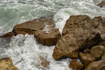 Waves during a storm. View from above. Red code. Rest on the Black Sea coast in Bulgaria. Elemental force.