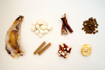 Variety of dog treats. Dod delicacy food on white background.