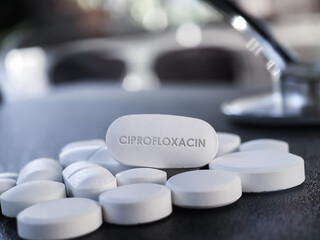 Obraz na płótnie Canvas Ciprofloxacin antiobiotic white pill medication