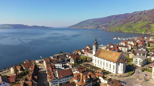 Aerial footage with a rotation motion of the Arth village by lake Zug in Canton Schwyz in Switzerland