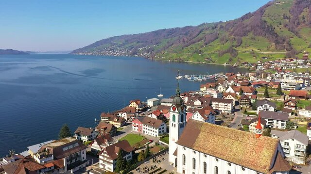 Aerial footage with a forward motion of the Arth village by lake Zug in Canton Schwyz in Switzerland