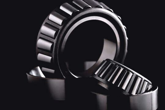 roller bearing on a black background close-up, blur as an artistic device
