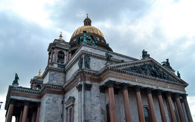 Fototapeta na wymiar Isaac's Cathedral, Saint Petersburg, Russia, 11.10.2020. The building in style of classicism. Facade, exterior with columns, sculpture, statues and relief. Gold dome.