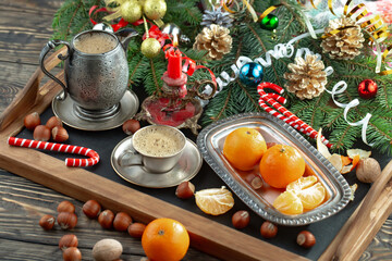 Merry Christmas card with gifts and, coffee and Christmas decorations.