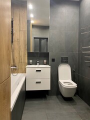 toilet room with toilet and bath