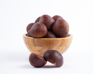 Fresh Chestnuts fruit isolated in wooden bowl on white background