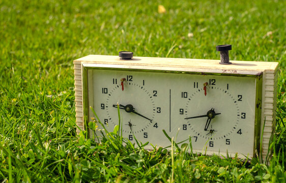 Clock for playing chess on the green grass