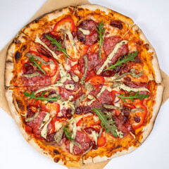 pizza with sausage, cheese, tomatoes and herbs
