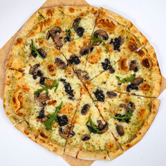 Pizza with cheese, herbs and mushrooms in an Italian pizzeria
