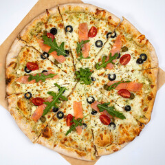 Pizza with cheese and salmon in an Italian pizzeria
