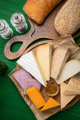 Assorted cheese on a wooden table in a restaurant
