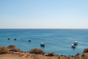 Boats fishing near the coast of Santorini island