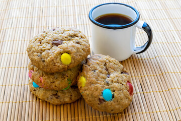 delicious colorful chocolate chip cookies with coffee