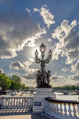 Fototapeta premium Paris, France - May 23, 2020: Famous street lantern on the Alexandre III Bridge in Paris