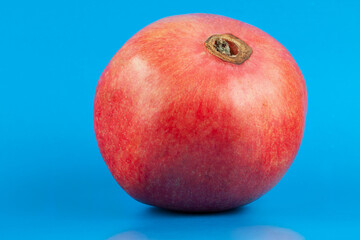 Pomegranate fruit on a blue background