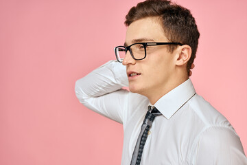 Business man in white shirt with tie wearing glasses self-confidence official pink background