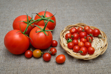 Ripe, fresh, red tomatoes on a coarse burlap