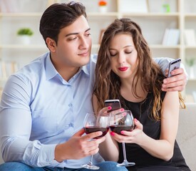 Young pair drinking wine in romantic concept