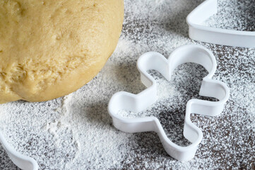 Gingerbread man cookie cutter and gingerbread dough. Christmas baking concept